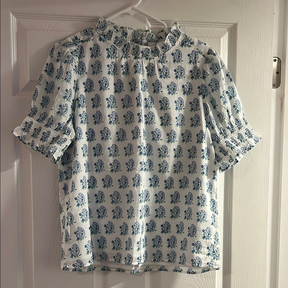 Women's White Short-Sleeve Smocked Neck Top with Blue Floral Print ECU lined.